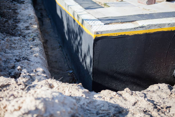 Professional Basement Waterproofing technician working in Mundelein, IL